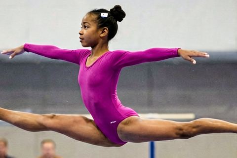 Closer again: the gymnast's leap fills the frame.